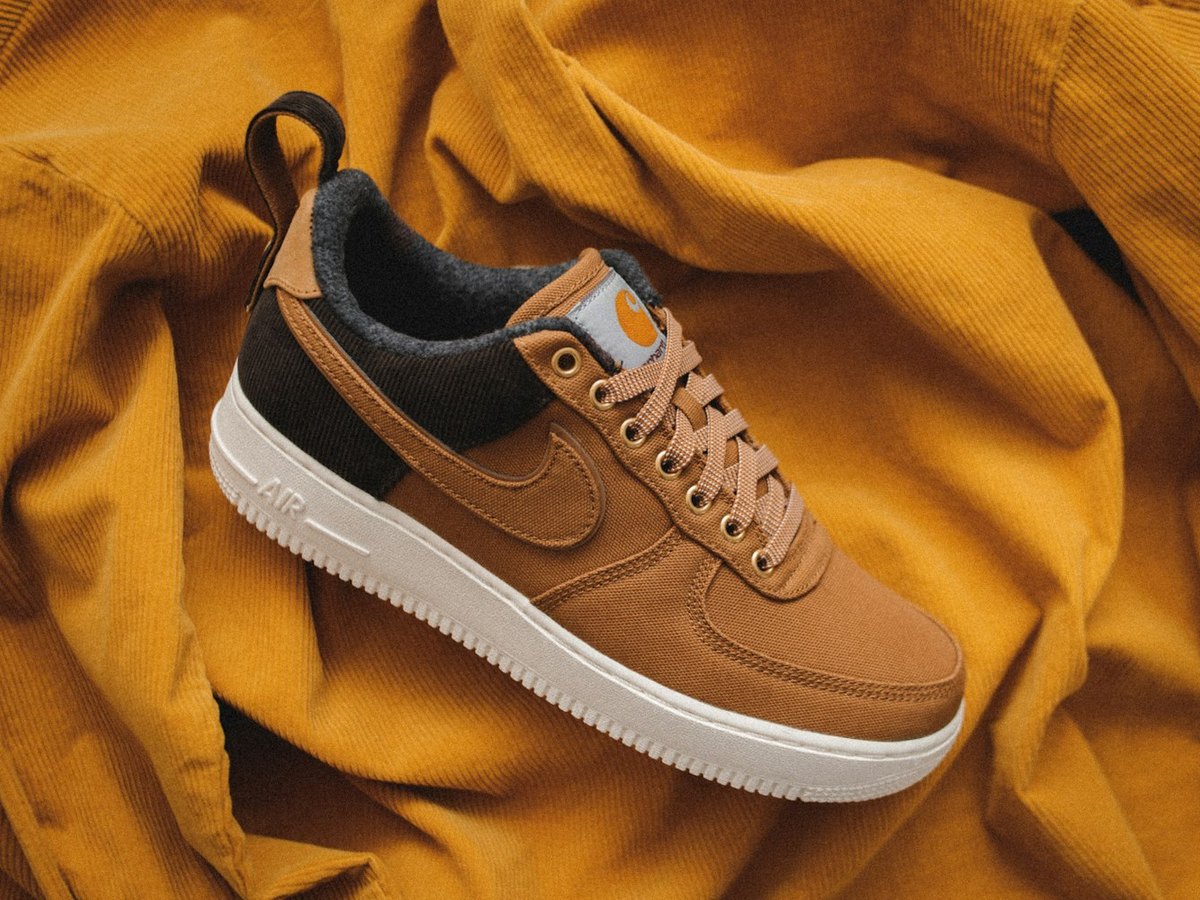 Sneaker photographed on a yellow sweater